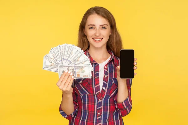 Payment for mobile services. Portrait of cheerful ginger girl in — Stok fotoğraf