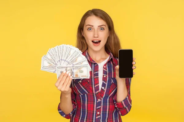 Online banking. Portrait of surprised happy ginger girl in shirt — Stok fotoğraf