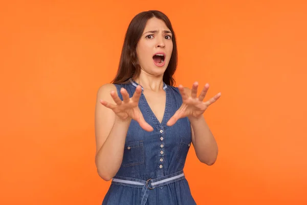 Female phobia. Frightened brunette woman in denim dress standing — Stockfoto