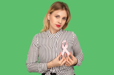 Lovely beautiful woman with red lips in striped blouse holding p