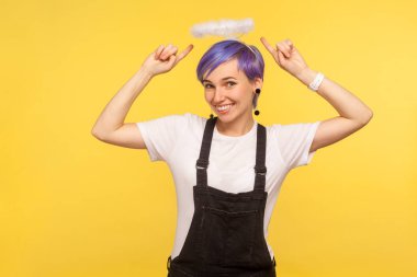 Portrait of positive beautiful hipster girl with angelic halo po