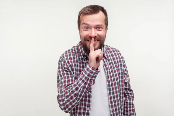 Be quiet! Portrait of cheerful bearded man making hush silence g — Stock Photo, Image