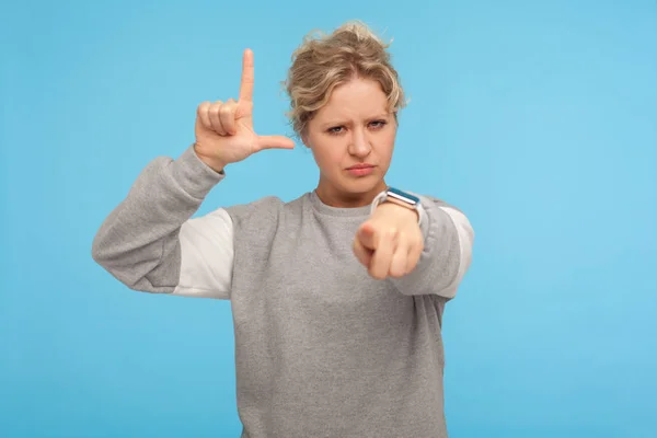 You are loser. Young woman with short curly hair in sweatshirt s — Stockfoto