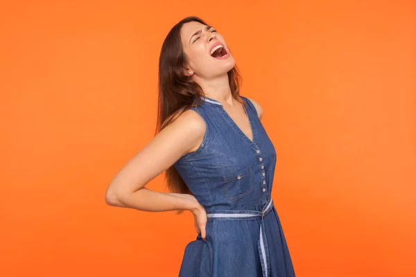 Terrible backache. Ill brunette woman holding lower back and scr — Stock Photo, Image