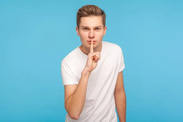 Shh, be quiet! Portrait of serious man in casual white t-shirt s — Stock Photo, Image