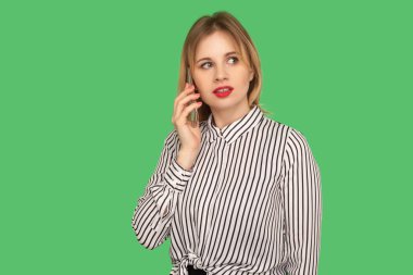 Mobile communication. Worried businesslady with red lips in glam