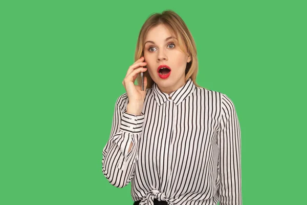 Astonished businesswoman in glamour striped shirt standing with — Stockfoto