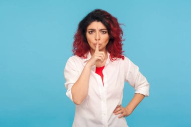 Shh, be quiet! Portrait of displeased hipster woman with fancy r