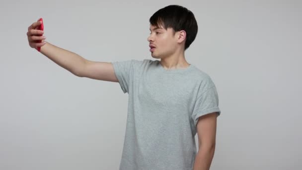 Guy Shirt Looking Smartphone Serious Attentive Expression Making Selfie Using — Stok video