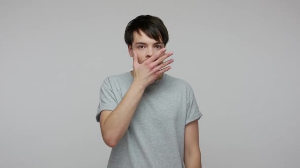Shocked Frightened Young Man Shirt Covering Mouth Hand Looking Terrified — Stockvideo
