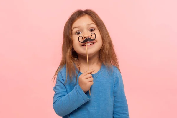 Portrait Cheerful Little Girl Holding Paper Mustache Smiling Camera Carefree — Stock Photo, Image