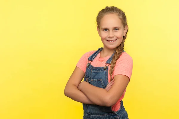 Portrait Cheerful Little Girl Braid Denim Overalls Holding Hands Crossed — Stock Photo, Image