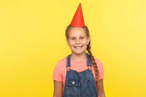 Portrait Joyous Adorable Little Girl Denim Overalls Funny Cone Head — Stock Photo, Image