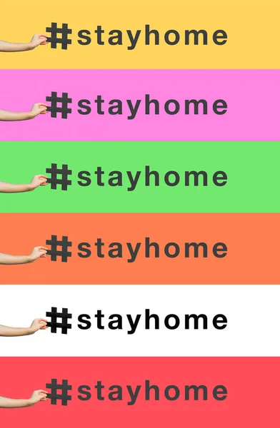 #stayhome. Stay at home hashtag. Social media concept. closeup of human hand holding and showing large big black hashtag sign. indoor studio shot, isolated on different colorful background copyspace.