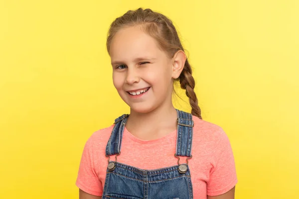 Portrait Funny Charming Little Girl Braid Denim Overalls Winking Camera — Stock Photo, Image