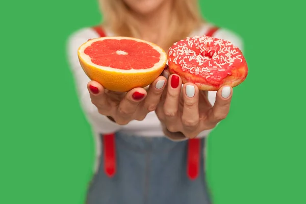 Closeup Female Showing Sweet Sugary Doughnut Fresh Juicy Grapefruit Offering — Stock Photo, Image