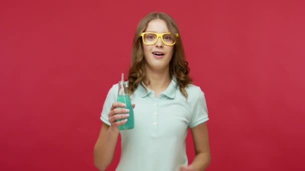 Joyful Young Woman Bright Eyeglasses Holding Blue Cocktail Dancing Drinking — Stock Video