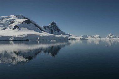 Paraiso Bay mountains landscape, Antarctic Pennsula. clipart