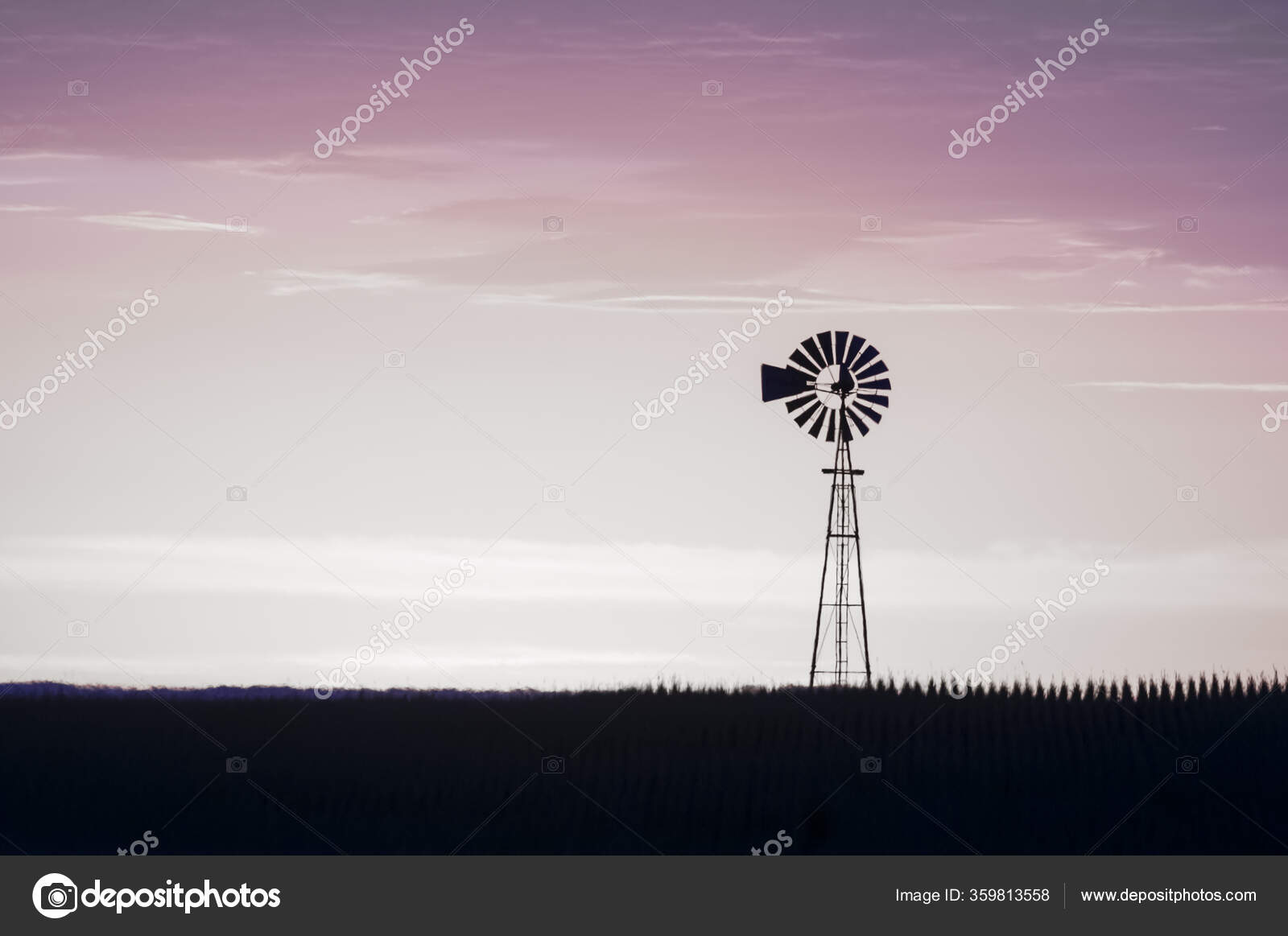 moinho de vento dentro a campo, às pôr do sol, pampas, Argentina
