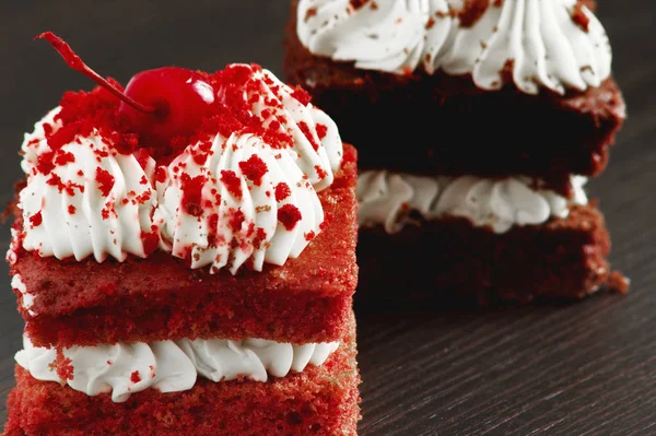 Piece of a cherry cake with cherry and whipped cream cakes chocolate cake