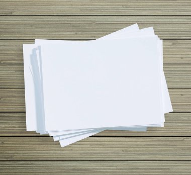 Ahşap masa arka plan üzerinde beyaz kağıt