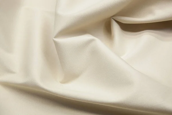 Dalgalı bej kumaş dokusu arkaplanı