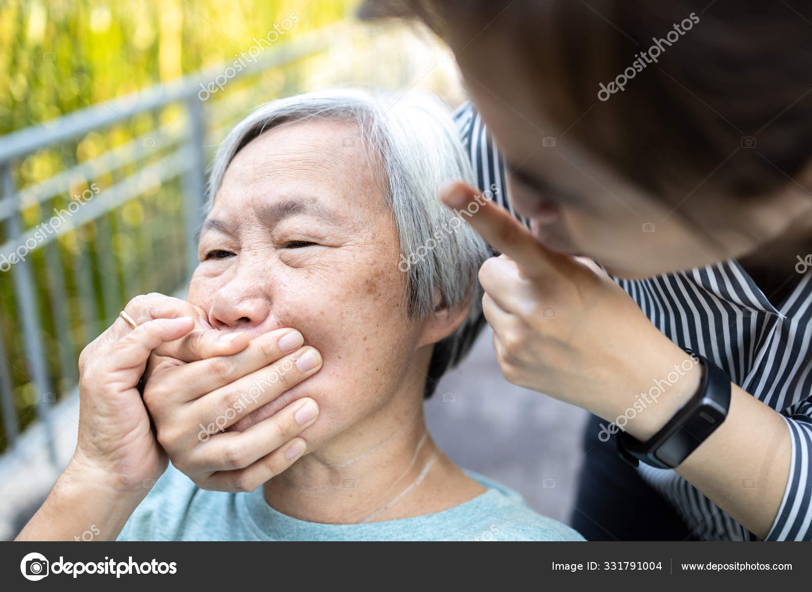 Angry asian woman covering senior mouth and showing silence gesture, keep a  secret be quiet,social violence,aggression, scared elderly people with  female caregiver,bad relationship,physical abuse Stock Photo by ©Chai2523  331791004