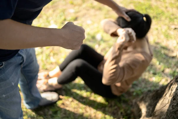 Angry asian man or husband threatening,showing fists about to punch hit woman or wife,girl victim from aggressive,female people crying suffer from physical abuse,family life problem,domestic violence