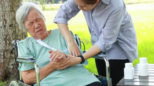 Injured Asian Senior Woman Wearing Elbow Support Suffering Arthritis Sore — Stock Video