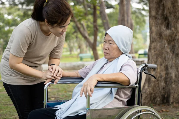 Elderly with depressive symptoms need close care,female caregiver is care,supporting,Alzheimer patient,depressed asian senior woman at nursing home,old people feel sad,tired of life,depression concept — Stock Photo, Image