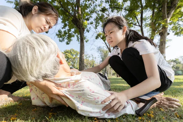 Sick asian senior woman fainting,syncope,chronic dizziness,unconscious fell to the floor suffer cardiac syncope,female elderly with postural hypotension, low blood pressure,heat stroke,health problem