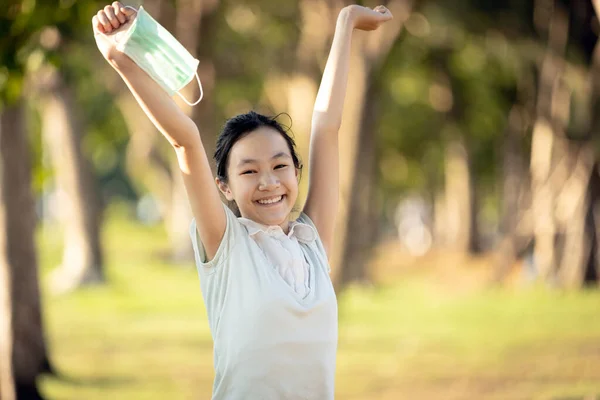 Happy Smiling Asian Child Girl Standing Raised Arms Holding Mask — Stock Photo, Image