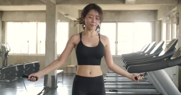 Attractive Asian Woman Skipping Jumping Rope Fitness Wellness Studio Gym — Stock Video