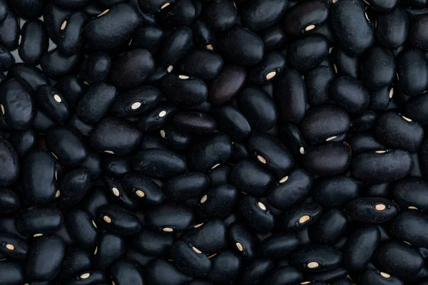 Fasulyelerin yakın çekim dokusu - ham siyah fasulye (baklagil)) — Stok fotoğraf