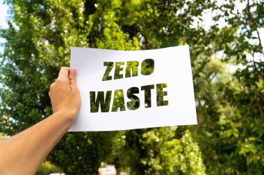 zero waste paper text with green grass on white background. lettering. ecology concept