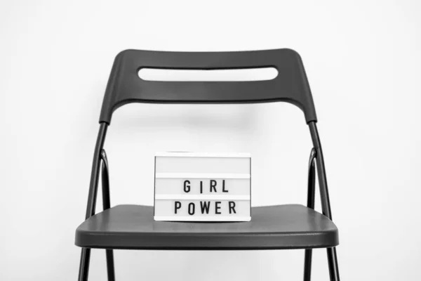 Uma mensagem de energia feminina na caixa de luz. fundo branco. Igualdade nos direitos de género. DEmocracia — Fotografia de Stock