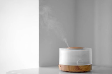 Humidifier with aroma oils at home. Minimal. Relaxation at home