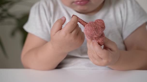 Toddler child plays with yellow sticky slime. Home activity for toddlers at home. Motor skills development — Stock Video