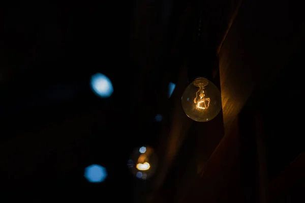 Light bulb on a dark background — Stock Photo, Image