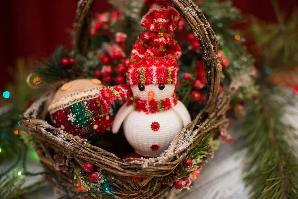 Christmas basket under the tree. Toy Santa Claus and Christmas basket