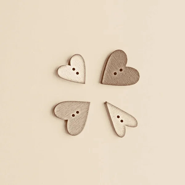 Four buttons in the form of a heart on paper. — Stock Photo, Image