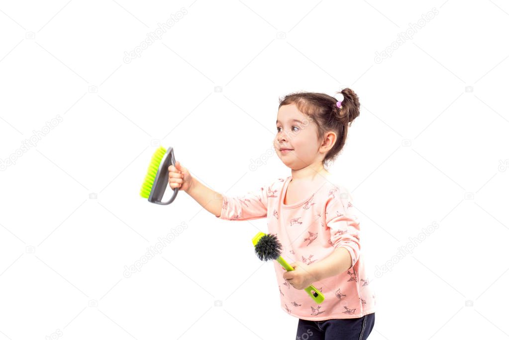 Little girl cleaning isolated on white background