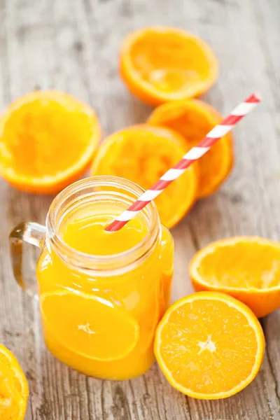 Orange Juice Squeezed In glass jar with fund rustic — Stock Photo, Image