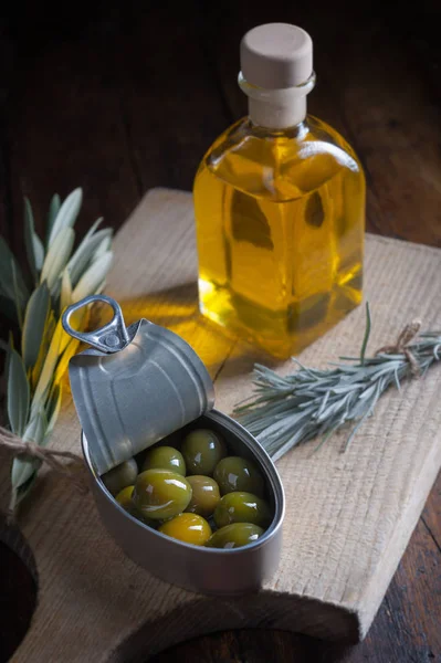 Olives on wooden table aged with little ligh — Stock Photo, Image
