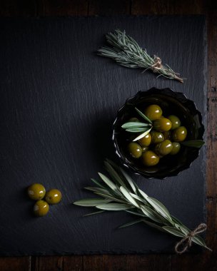 Olives on wood aged in close-up in Zenith sho clipart