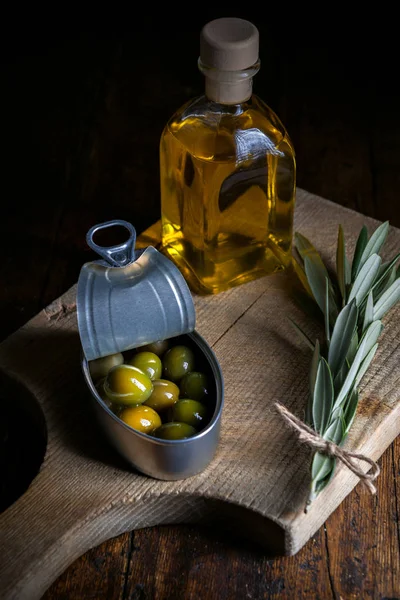 Olives on wooden table aged with little ligh — Stock Photo, Image