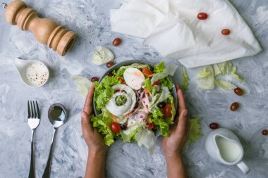 Concept for a tasty and healthy vegetarian meal. healthy vegan lunch bowl. Top view Greek salad on stone background.