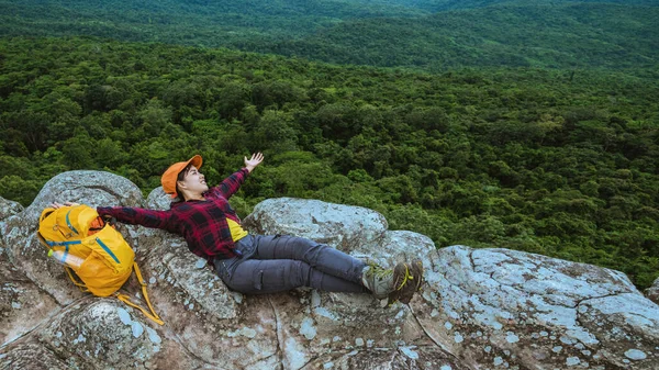 woman asians travel relax in the holiday. View mountain nature on the cliffs.