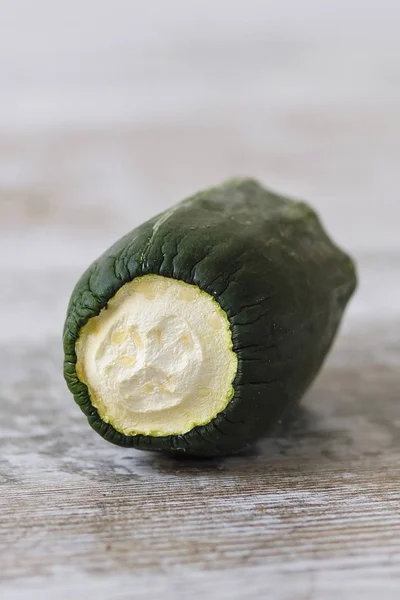 Expired vegetables over a wooden table