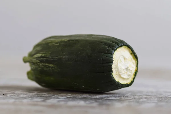 Expired vegetables over a wooden table